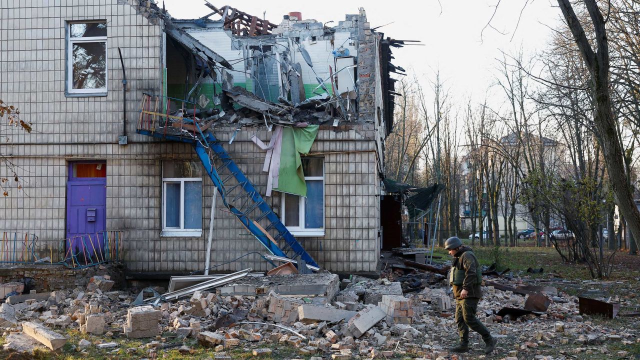 Police officers inspect the compound of a kindergarten damaged during Russian drone strikes, amid Russia's attack on Ukraine, in Kyiv, Ukraine November 25, 2023. REUTERS/Valentyn Ogirenko